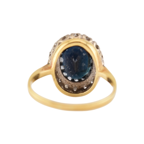 108 - An 18ct gold sapphire and diamond cluster ring. Stamped 18ct. Weight 3.9g. Size K