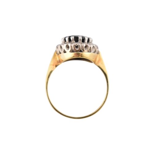 108 - An 18ct gold sapphire and diamond cluster ring. Stamped 18ct. Weight 3.9g. Size K