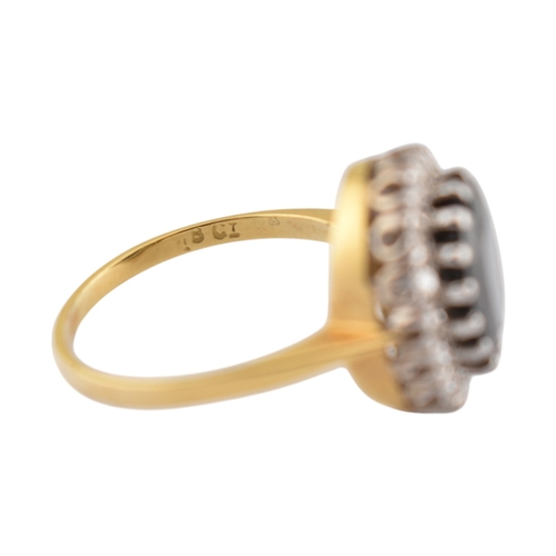 108 - An 18ct gold sapphire and diamond cluster ring. Stamped 18ct. Weight 3.9g. Size K