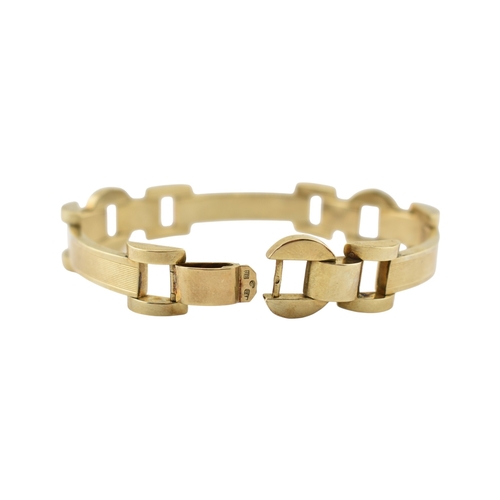 110 - A 14ct gold retro tank bracelet. The bracelet with engine turned and arced and semi-circular links t... 