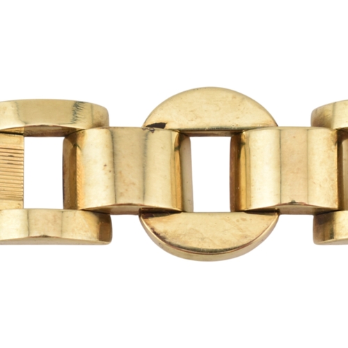 110 - A 14ct gold retro tank bracelet. The bracelet with engine turned and arced and semi-circular links t... 