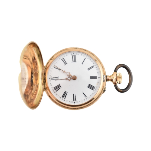 115 - A 14ct gold full hunter fob watch. The watch having floral decorated case, metal movement cover. Whi... 