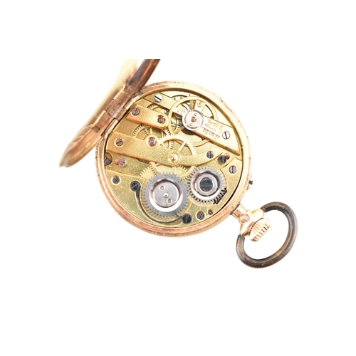 115 - A 14ct gold full hunter fob watch. The watch having floral decorated case, metal movement cover. Whi... 