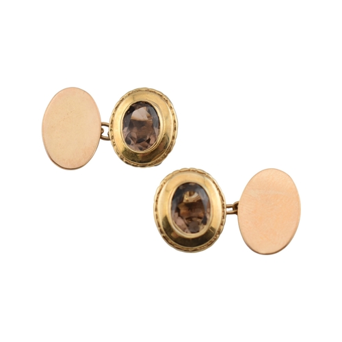 116 - Pair of hallmarked 9ct gold and smoky quartz cufflinks. Weight 7.2g. Measures head 1.6cm. 