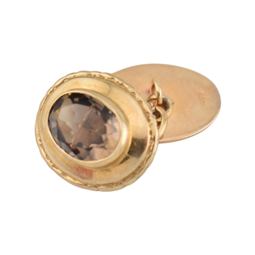 116 - Pair of hallmarked 9ct gold and smoky quartz cufflinks. Weight 7.2g. Measures head 1.6cm. 