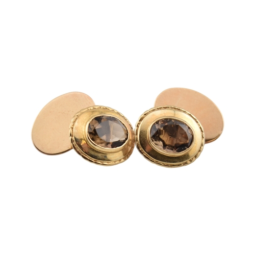 116 - Pair of hallmarked 9ct gold and smoky quartz cufflinks. Weight 7.2g. Measures head 1.6cm. 