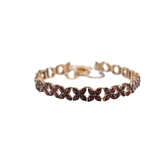 117 - An early 20th century Bohemian garnet bracelet with a hallmarked 9ct gold padlock clasp. The clasp i... 