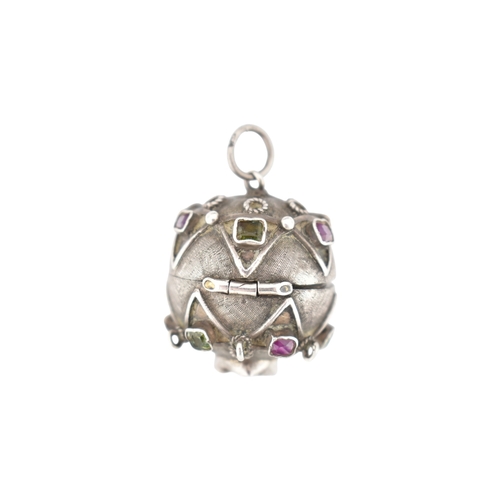 119 - A French silver gem set orb locket pendant. The orb set with multicoloured foil back gems to a textu... 