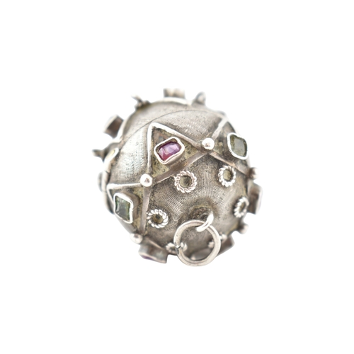 119 - A French silver gem set orb locket pendant. The orb set with multicoloured foil back gems to a textu... 