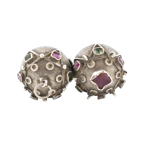 119 - A French silver gem set orb locket pendant. The orb set with multicoloured foil back gems to a textu... 