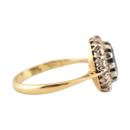 181 - A hallmarked 18ct gold sapphire and diamond cluster ring. Hallmarked London. Weight 3.1g. Size L.5.... 