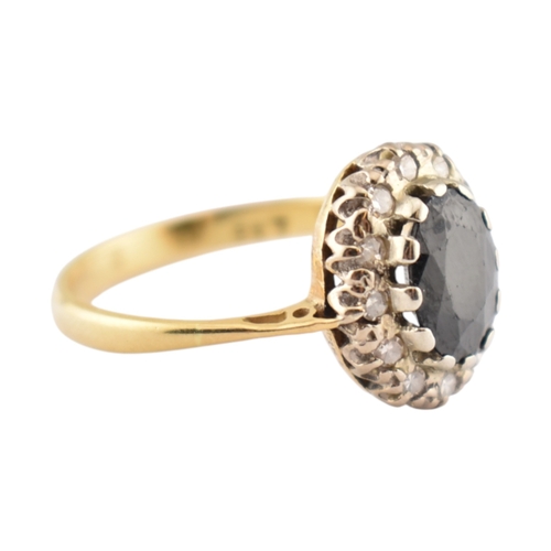 181 - A hallmarked 18ct gold sapphire and diamond cluster ring. Hallmarked London. Weight 3.1g. Size L.5.... 