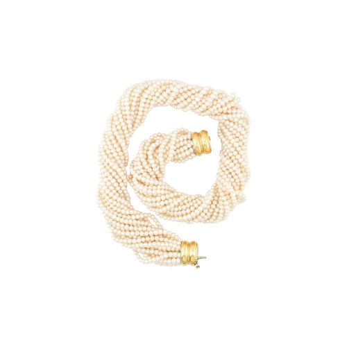 184 - A multistrand pearl necklace with an oversized box clasp. The necklace strung with 18 strands of cul... 