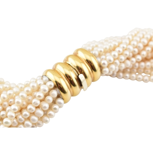 184 - A multistrand pearl necklace with an oversized box clasp. The necklace strung with 18 strands of cul... 