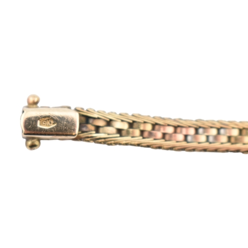 185 - A 9ct gold tri-colour bracelet. Set with push clasp. Stamped 9k. Weight 9.8g. Measures 16cm