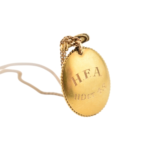 190 - A Victorian 19th century gold Etruscan revival enamel, pearl and diamond pendant and chain. The oval... 