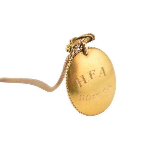 190 - A Victorian 19th century gold Etruscan revival enamel, pearl and diamond pendant and chain. The oval... 