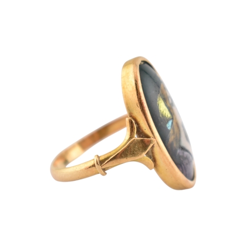 198 - An Art Nouveau 18ct gold French Limoges panel ring. The ring set with a Limoges enamel image of a ma... 