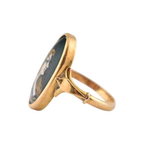 198 - An Art Nouveau 18ct gold French Limoges panel ring. The ring set with a Limoges enamel image of a ma... 