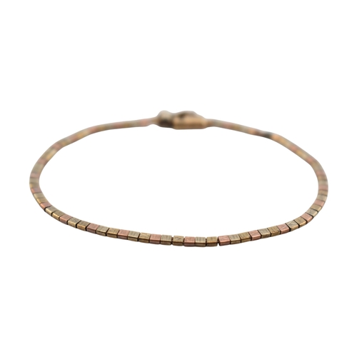 202 - A hallmarked 9ct gold tri-colour bracelet. The bracelet with fancy box linkage. Weight 4.8g. Measure... 