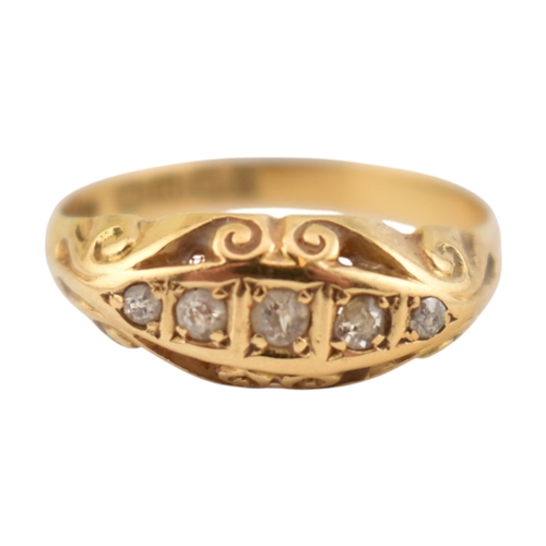 208 - An early 20th century hallmarked 18ct gold & diamond five stone boat ring. The ring set with fiv... 