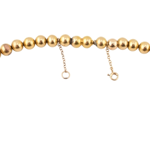 212 - A 14ct gold bead collar necklace. The necklace is formed with graduating round beads with push clasp... 