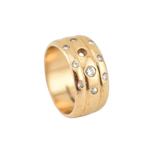 214 - A hallmarked 9ct gold and diamond wide ribbed band ring. Weight 8.7g. Size Q. One diamond deficient.... 
