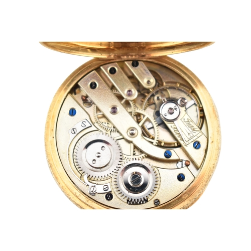 215 - An 18ct gold Swiss open face pocket watch. The watch having a white dial with Roman numeral hour mar... 