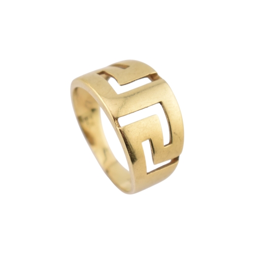 216 - An 18ct gold band ring. The ring with pierced Greek key decoration. Stamped 750. Weight 5.9g. Size R... 