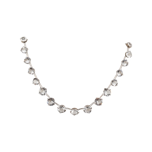217 - An early 20th century silver and rhinestone riviere necklace. The necklace stamped 'pat app for' ste... 