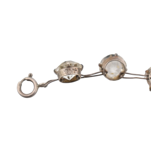 217 - An early 20th century silver and rhinestone riviere necklace. The necklace stamped 'pat app for' ste... 