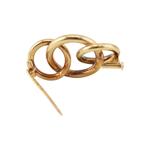 225 - A retro 14ct gold Knot brooch pin. The brooch with three entwined concentric circles to a trombone c... 