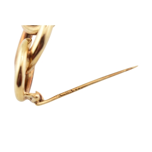 225 - A retro 14ct gold Knot brooch pin. The brooch with three entwined concentric circles to a trombone c... 