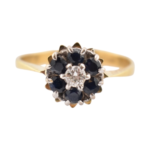 227 - A hallmarked 18ct gold sapphire and diamond cluster ring. Hallmarked Birmingham. Weight 2.7g. Size O... 