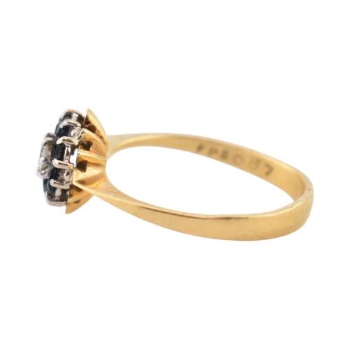 227 - A hallmarked 18ct gold sapphire and diamond cluster ring. Hallmarked Birmingham. Weight 2.7g. Size O... 