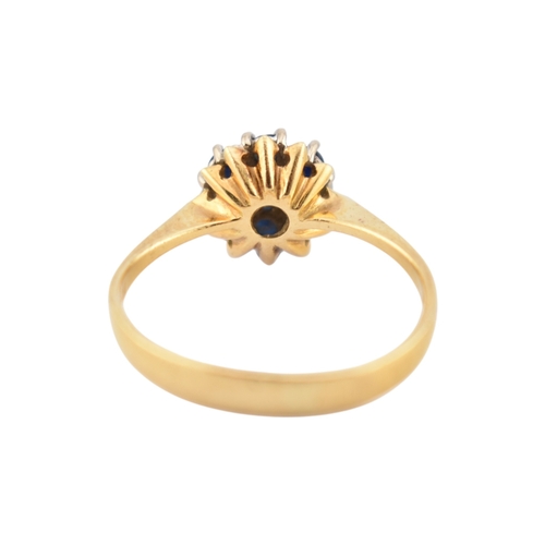 227 - A hallmarked 18ct gold sapphire and diamond cluster ring. Hallmarked Birmingham. Weight 2.7g. Size O... 