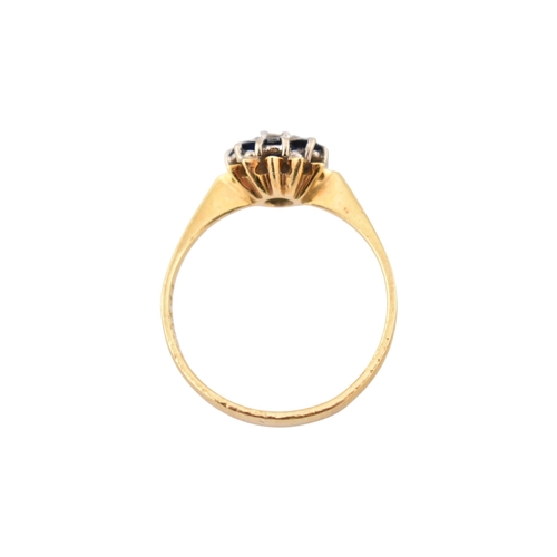 227 - A hallmarked 18ct gold sapphire and diamond cluster ring. Hallmarked Birmingham. Weight 2.7g. Size O... 
