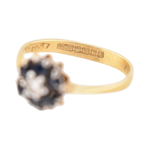 227 - A hallmarked 18ct gold sapphire and diamond cluster ring. Hallmarked Birmingham. Weight 2.7g. Size O... 