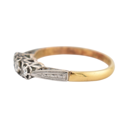 229 - An 18ct gold and platinum three stone diamond ring. Stamped 18ct & Plat. Weight 1.8g. Size K... 