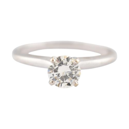 235 - A 14ct white gold and diamond solitaire ring. The ring set with a single round brilliant cut diamond... 