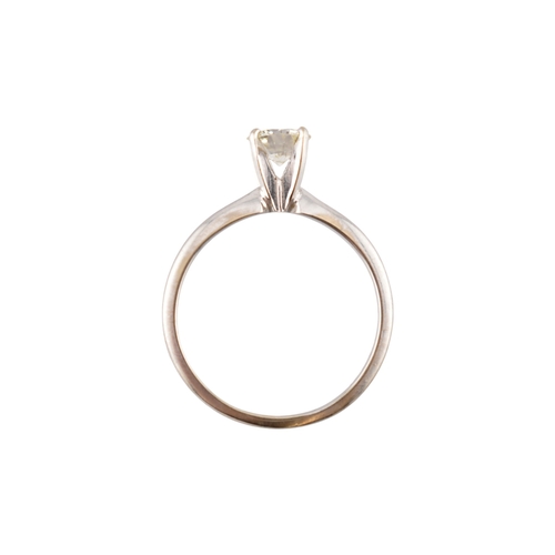235 - A 14ct white gold and diamond solitaire ring. The ring set with a single round brilliant cut diamond... 