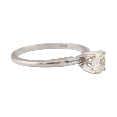 235 - A 14ct white gold and diamond solitaire ring. The ring set with a single round brilliant cut diamond... 