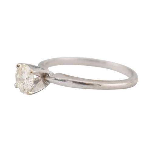 235 - A 14ct white gold and diamond solitaire ring. The ring set with a single round brilliant cut diamond... 