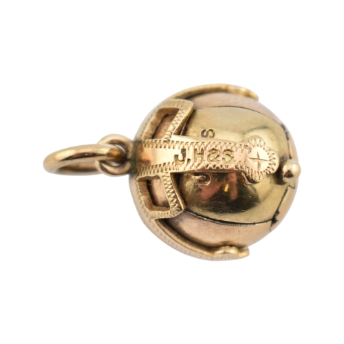 236 - A gold on silver masonic orb pendant with articulated action to cross pendant. Stamped HJ&S Made... 