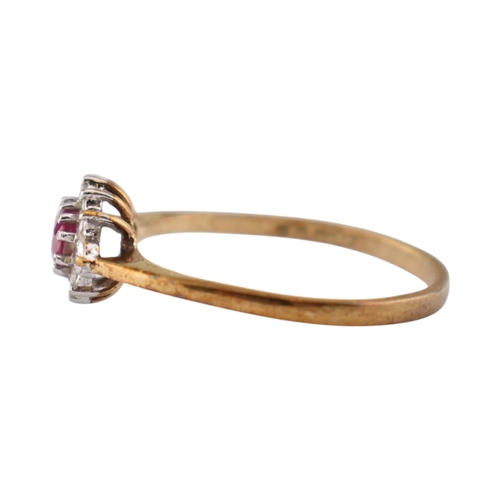 239 - A hallmarked 9ct gold ruby and diamond halo ring. Weight 1.9g. Size U