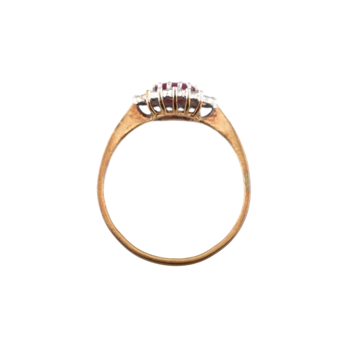 239 - A hallmarked 9ct gold ruby and diamond halo ring. Weight 1.9g. Size U