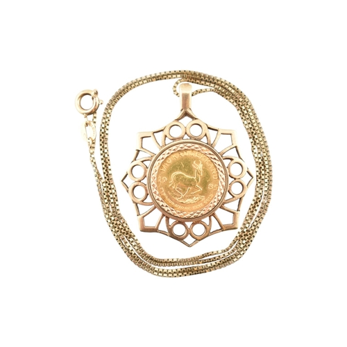 304 - A 1/10 gold Krugerrand pendant necklace. The 1/10 Krugerrand in a 9ct gold pendant mount strung upon... 