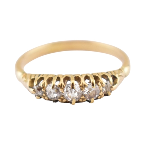 305 - An 18ct gold and diamond five stone ring. Unmarked, tests indicate 18ct gold. Weight 2.8g. Size P... 