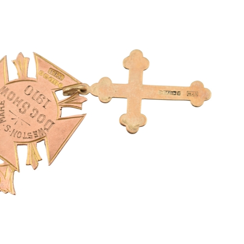 314 - A collection of 9ct gold pendants. To include an armorial medal pendant marked for Weston Super Mare... 