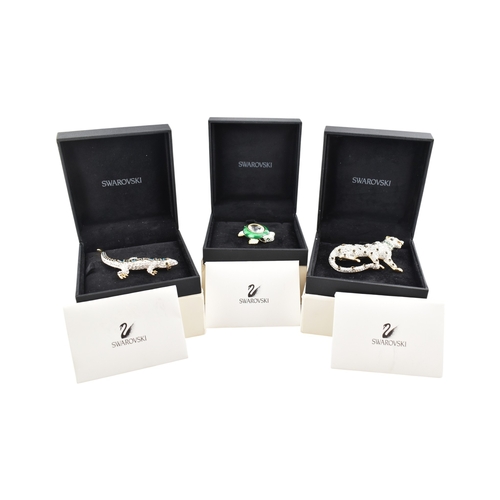 315 - Three boxed vintage Swarovski brooches, in original black Swarovski boxes as well as white outer box... 